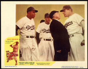 Jackie Robinson in Brooklyn Dodgers uniform, swinging bat by American Photo