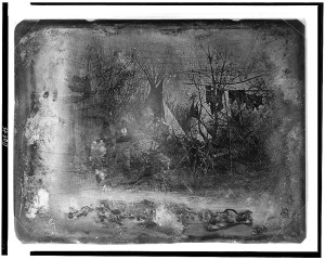 View of a Cheyenne village at Big Timbers, in present-day Colorado, with four large tipis standing at the edge of a wooded area. Frame with pemmican or hides hanging at the right; two figures, facing camera, standing to the left of center. Library of Congress Prints & Photographs Division, LC-USZ62-110045 View of a Cheyenne village at Big Timbers, in present-day Colorado, with four large tipis standing at the edge of a wooded area. Frame with pemmican or hides hanging at the right; two figures, facing camera, standing to the left of center. Library of Congress Prints & Photographs Division, LC-USZ62-110045